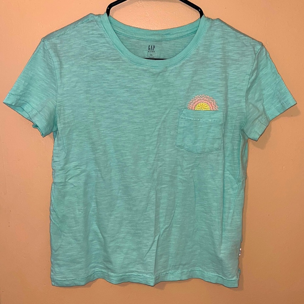Gap T-shirt with cute embroidered sun on the pocket.